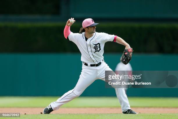 Pete Kozma of the Detroit Tigers throws to first after fielding a grounder against the Seattle Mariners at Comerica Park on May 13, 2018 in Detroit,...