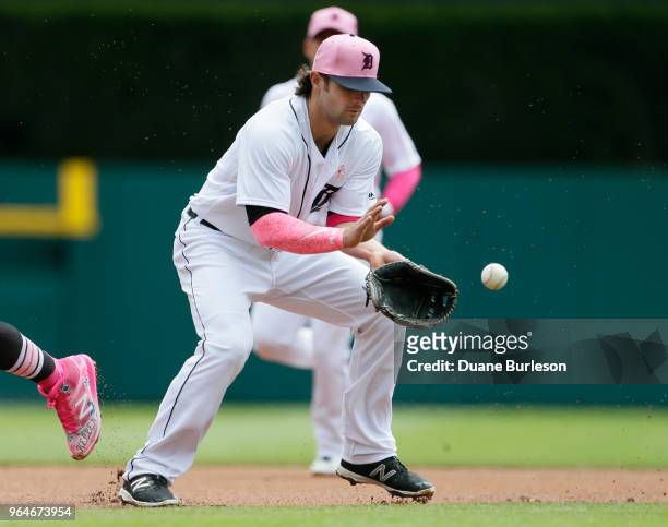 Pete Kozma of the Detroit Tigers fields a grounder against the Seattle Mariners at Comerica Park on May 13, 2018 in Detroit, Michigan. Both teams are...