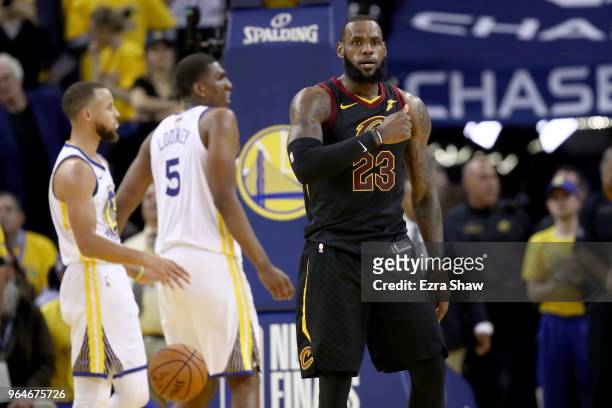 LeBron James of the Cleveland Cavaliers reacts against the Golden State Warriors in Game 1 of the 2018 NBA Finals at ORACLE Arena on May 31, 2018 in...