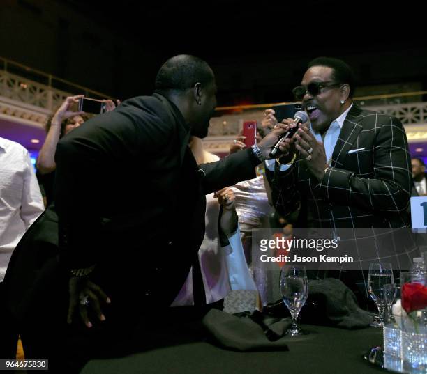 Singer-songwriter Johnny Gill performs in the crowd next to musician Charlie Wilson during NMAAM Celebration of Legends Galaon May 31, 2018 in...