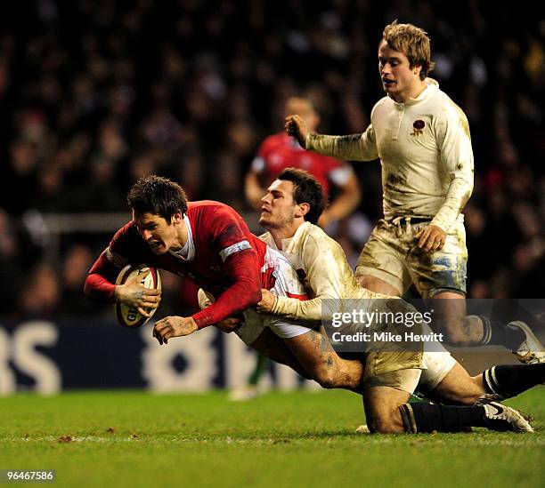 James Hook of Wales is tackled by Danny Care of England as he scores a try during the RBS 6 Nations Championship match between England and Wales at...