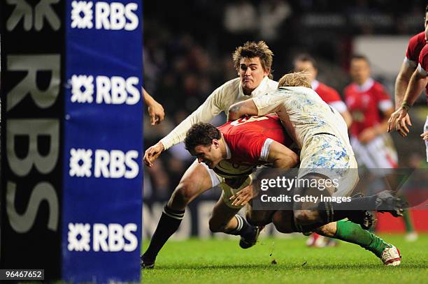 Jamie Roberts of Wales is tackled just short of the try line during the RBS 6 Nations Championship match between England and Wales at Twickenham...