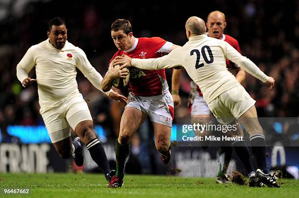 Shane Williams of Wales is tackled by Paul Hodgson of England during the RBS 6 Nations Championship match between England and Wales at Twickenham...