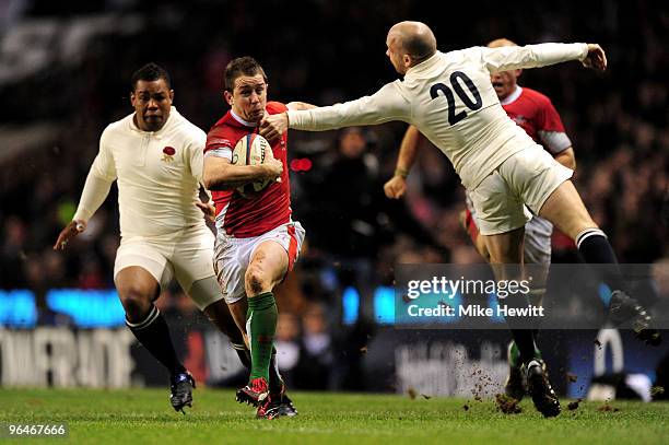 Shane Williams of Wales is tackled by Paul Hodgson of England during the RBS 6 Nations Championship match between England and Wales at Twickenham...