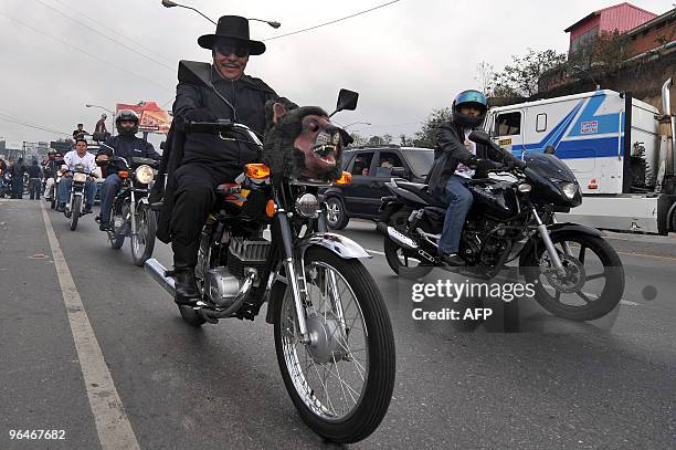 Motorcycle riders take part in the caravan known as "La Caravana del Zorro" as they head out of Guatemala City on their way to Esquipulas on February...