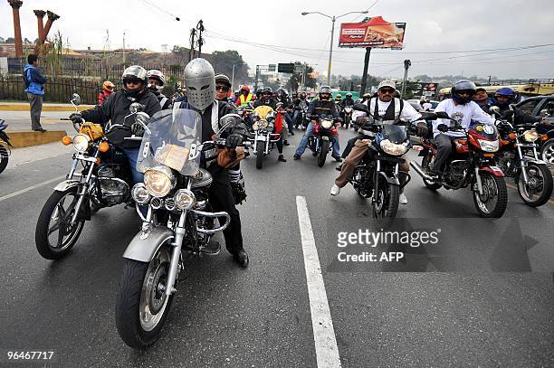 Motorcycle riders take part in the caravan known as "La Caravana del Zorro" as they head out of Guatemala City on their way to Esquipulas on February...
