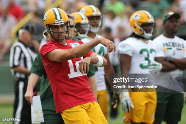 Green Bay Packers quarterback Aaron Rodgers throws a pass during Green Bay Packers Organized Team Activities at Ray Nitschke Field on May 31, 2018 in...