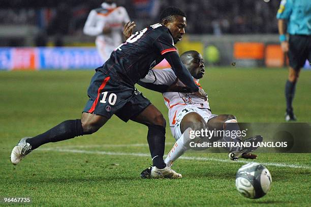 Paris Saint-Germain's striker Stephane Sessegnon From Benin vies with Lorient's defender Arnold Mvuemba during their French L1 football match PSG v....