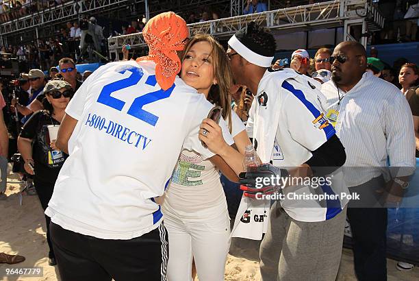 Singer Jennifer Lopez with Shawn Wayans and Marlon Wayans attend the Fourth Annual DIRECTV Celebrity Beach Bowl at DIRECTV Celebrity Beach Bowl...