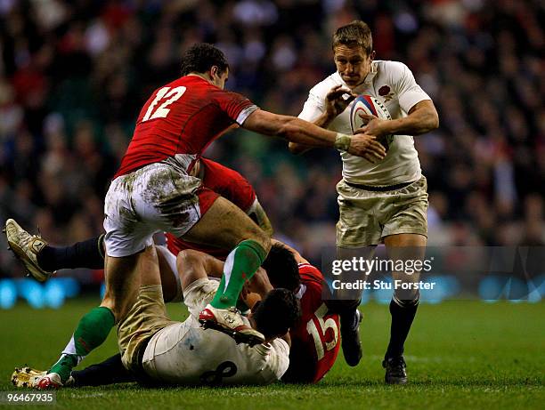 Jonny Wilkinson of England holds off Jamie Roberts of Wales during the RBS 6 Nations Championship match between England and Wales at Twickenham...