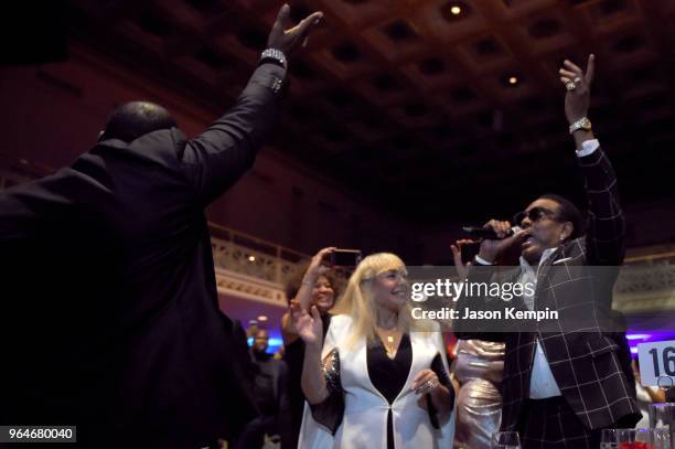 Singer-songwriter Johnny Gill performs in the crowd next to Mahin Wilson and musician Charlie Wilson during NMAAM Celebration of Legends Galaon May...