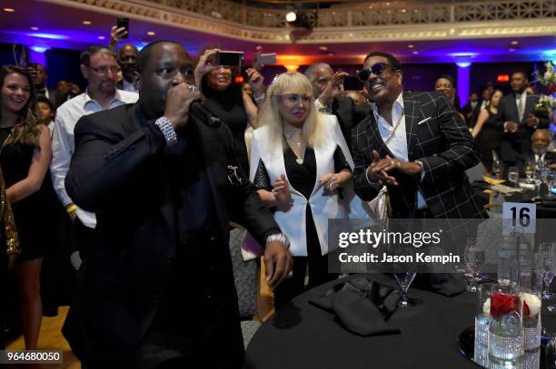 Singer-songwriter Johnny Gill performs in the crowd next to Mahin Wilson and musician Charlie Wilson during NMAAM Celebration of Legends Galaon May...