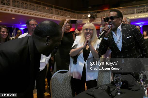 Singer-songwriter Johnny Gill performs in the crowd next to Mahin Wilson and musician Charlie Wilson during NMAAM Celebration of Legends Galaon May...