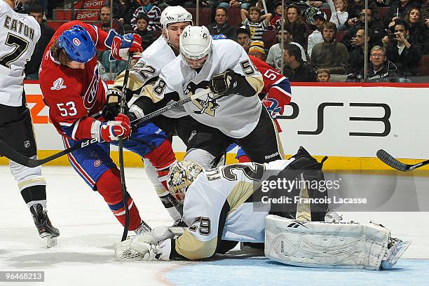 Ryan White of Montreal Canadiens takes a shot on goalie Marc-Andre Fleury of Pittsburgh Penguins during the NHL game on February 6, 2010 at the Bell...