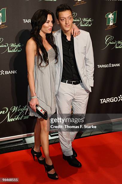 Mesut Oezil and his girlfriend Anna Maria Lagerblom pose during the Werder Bremen Green White Night 2010 at the Congress Centre on February 6, 2010...