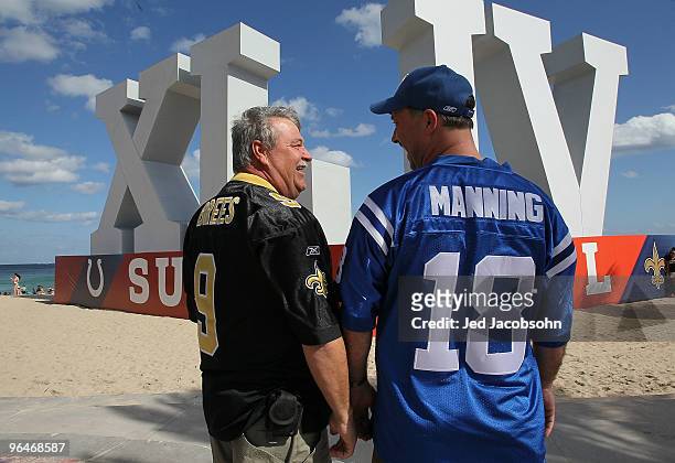 Alan Mesh of Lafayette, Louisiana and Todd Diaz of Indianapolis, Indiana walk on Fort Lauderdale Beach on February 6, 2010 in Fort Lauderdale,...