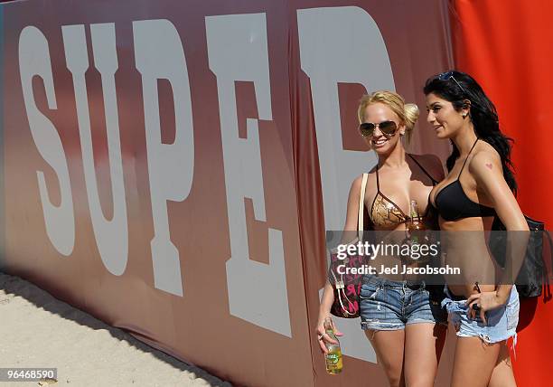 Fans walk on Fort Lauderdale Beach on February 6, 2010 in Fort Lauderdale, Florida. Super Bowl XLIV between the Indianapolis Colts and the New...