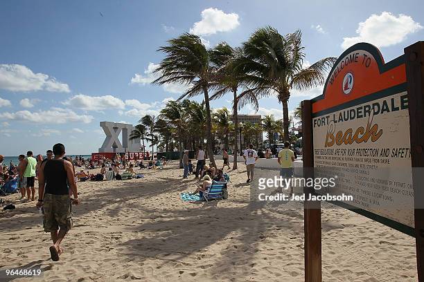 Fans walk on Fort Lauderdale Beach on February 6, 2010 in Fort Lauderdale, Florida. Super Bowl XLIV between the Indianapolis Colts and the New...