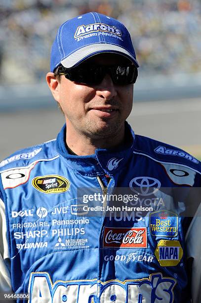 David Reutimann, driver of the Aaron's Dream Machine Toyota, stands on pit road during qualifying for the Daytona 500 at Daytona International...