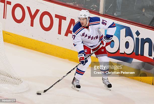 Matt Gilroy of the New York Rangers skates with the puck during the NHL game against the Phoenix Coyotes at Jobing.com Arena on January 30, 2010 in...