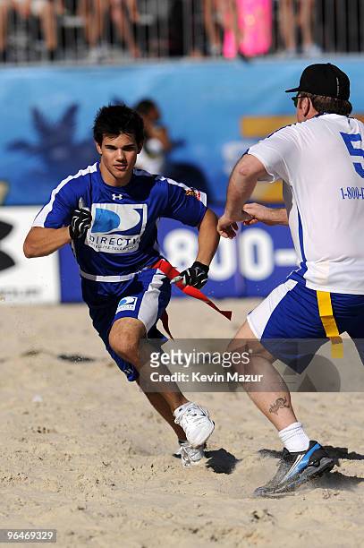 Actor Taylor Lautner runs down field at the Fourth Annual DIRECTV Celebrity Beach Bowl at DIRECTV Celebrity Beach Bowl Stadium: South Beach on...