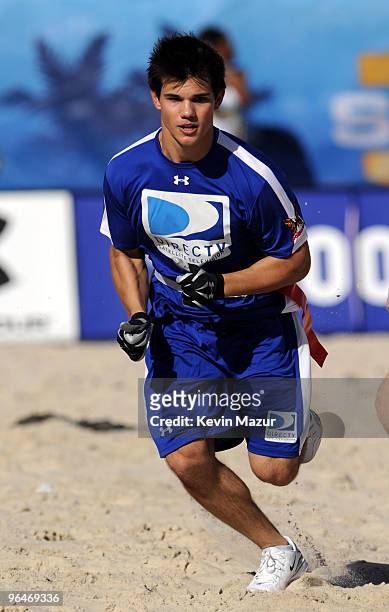 Actor Taylor Lautner runs down field at the Fourth Annual DIRECTV Celebrity Beach Bowl at DIRECTV Celebrity Beach Bowl Stadium: South Beach on...