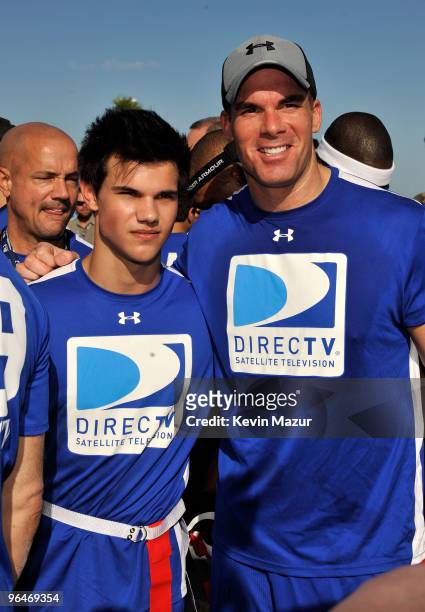 Taylor Lautner and Brandon Molale attend the DIRECTV's 4th Annual Celebrity Beach Bowl on February 6, 2010 in Miami Beach, Florida.