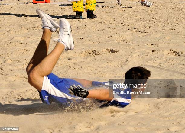 Actor Taylor Lautner plays at the Fourth Annual DIRECTV Celebrity Beach Bowl at DIRECTV Celebrity Beach Bowl Stadium: South Beach on February 6, 2010...