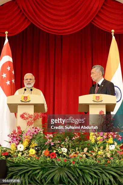 Indian Prime Minister Narendra Modi speaks during a joint press conference as Singapore Prime Minister, Lee Hsien Loong looks on at the Istana on...