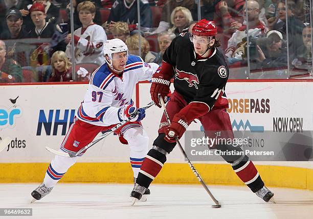 Martin Hanzal of the Phoenix Coyotes skates with the puck during the NHL game against the New York Rangers at Jobing.com Arena on January 30, 2010 in...