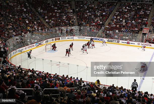 The New York Rangers and the Phoenix Coyotes face off during the NHL game at Jobing.com Arena on January 30, 2010 in Glendale, Arizona. The Coyotes...