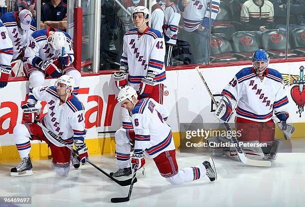 Christopher Higgins, Wade Redden, Artem Anisimov and Chad Johnson of the New York Rangers await the start of the NHL game against the Phoenix Coyotes...