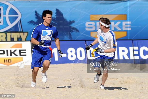 Actors Taylor Lautner and Kellan Lutz playat the Fourth Annual DIRECTV Celebrity Beach Bowl at DIRECTV Celebrity Beach Bowl Stadium: South Beach on...