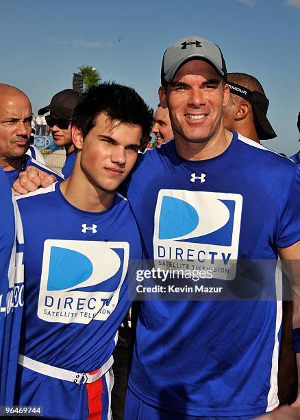 Taylor Lautner and Brandon Molale attend the DIRECTV's 4th Annual Celebrity Beach Bowl on February 6, 2010 in Miami Beach, Florida.