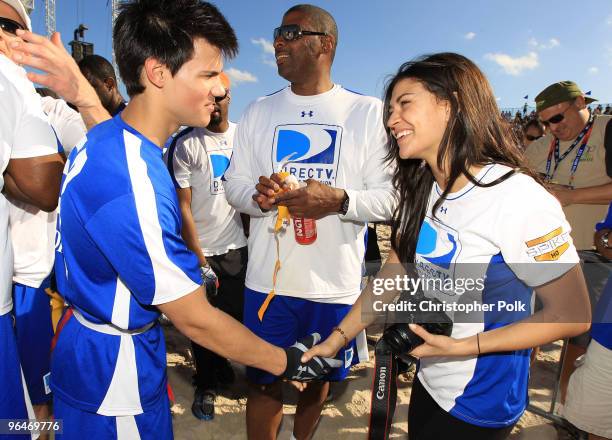 Actors Taylor Lautner and Jessica Szohr attend the Fourth Annual DIRECTV Celebrity Beach Bowl at DIRECTV Celebrity Beach Bowl Stadium: South Beach on...