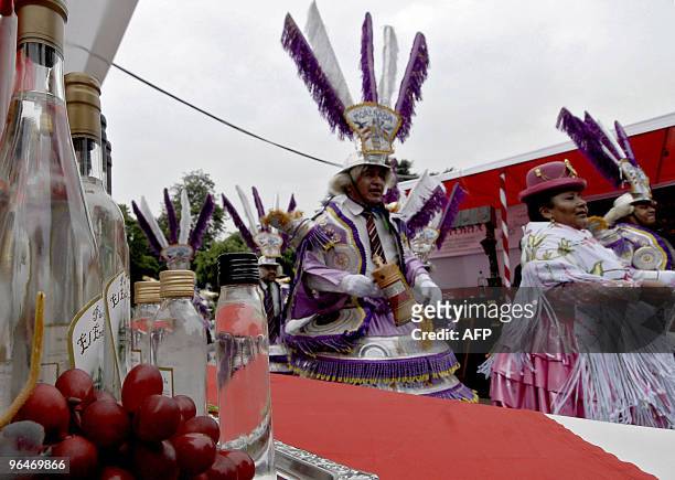 Dancers in traditional costumes participate of the celebration of the Pisco Sour Day in Lima on February 6, 2010. Pisco Sour - a Peruvian traditional...
