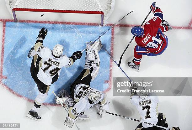 Scott Gomez of Montreal Canadiens makes a goal on goalie Marc-Andre Fleury of Pittsburgh Penguins during the NHL game on February 6, 2010 at the Bell...