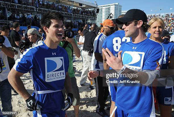Actors Taylor Lautner and Chace Crawford attend DIRECTV's 4th Annual Celebrity Beach Bowl on February 6, 2010 in Miami Beach, Florida.