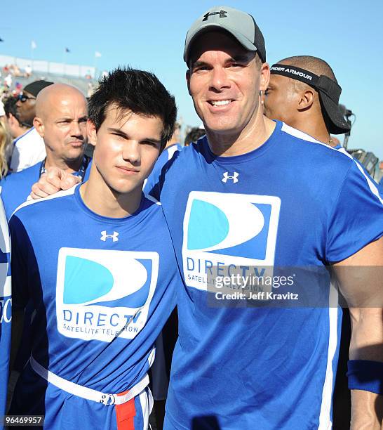 Actors Taylor Lautner and Brandon Molale attend DIRECTV's 4th Annual Celebrity Beach Bowl on February 6, 2010 in Miami Beach, Florida.