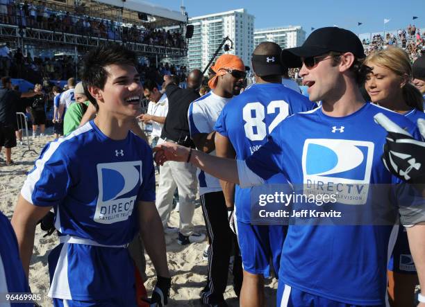 Actors Taylor Lautner and Chace Crawford attend DIRECTV's 4th Annual Celebrity Beach Bowl on February 6, 2010 in Miami Beach, Florida.