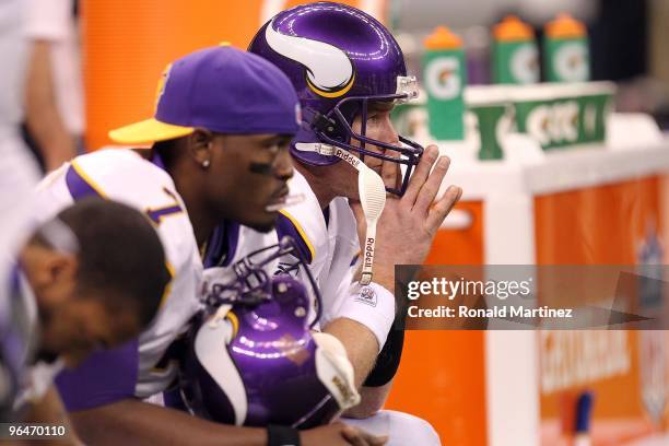 Brett Favre and Tavaris Jackson of the Minnesota Vikings look on dejected from the bench late in the game against the New Orleans Saints during the...