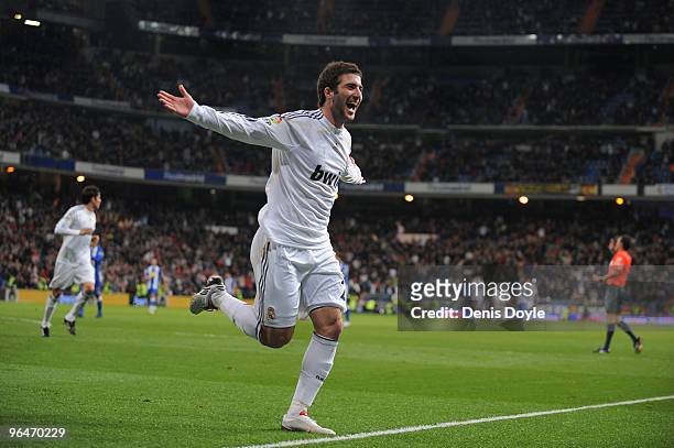 Gonzalo Higuain of Real Madrid celebrates after scoring Real's third goal during the La Liga match between Real Madrid and Espanyol at Estadio...