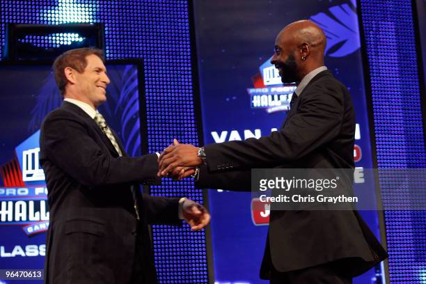 Jerry Rice is congratulated by fomer teammate Steve Young after Rice was announced as an 2010 enshrinee into the Hall of Fame during the Pro Football...
