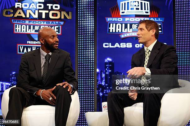 Former teammates Jerry Rice and Steve Young talk on stage after Rice was announced as one of the newest enhrinees into the Hall of Fame during the...