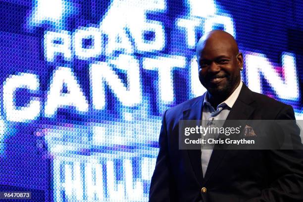 Emmitt Smith smiles as he walks on the stage after being announced as one of the newest enhrinees into the Hall of Fame during the Pro Football Hall...