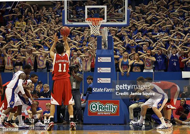 Kansas Jayhawks fans try to distract Christian Standhardinger of the Nebraska Cornhuskers as he shoots a free throw during the game on February 6,...