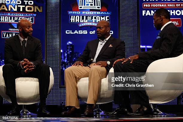 Jerry Rice, Emmitt Smith and Michael Irvin speak on stage after Smith and Rice were announced as one of the newest enshrinees into the Hall of Fame...