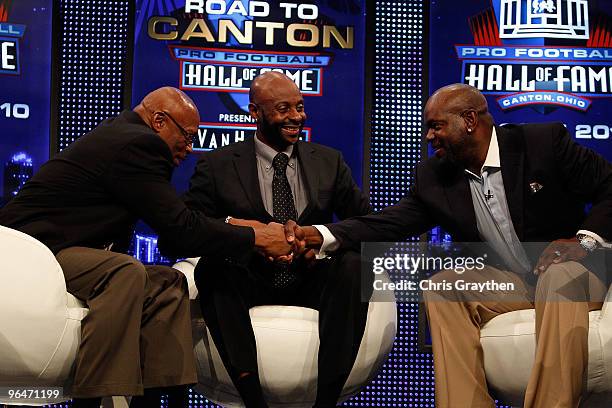 Members of the Pro Football Hall of Fame Class of 2010 Floyd Little, Jerry Rice and Emmitt Smith congratulate each other after they were announced as...