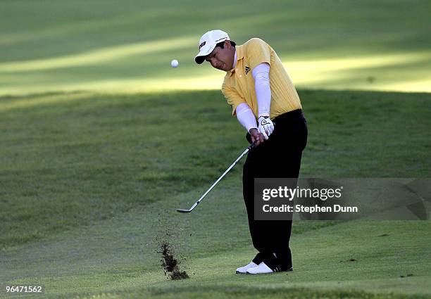 Andres Romero of Argentina pitches onto the green on the 11th hole during the third round of the Northern Trust Open at Riviera Country Club on...