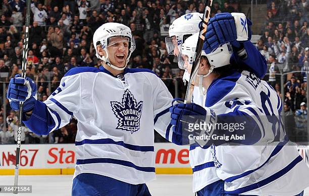Carl Gunnarsson of the Toronto Maple Leafs celebrates a first period goal with teammates during game action against the Ottawa Senators February 6,...